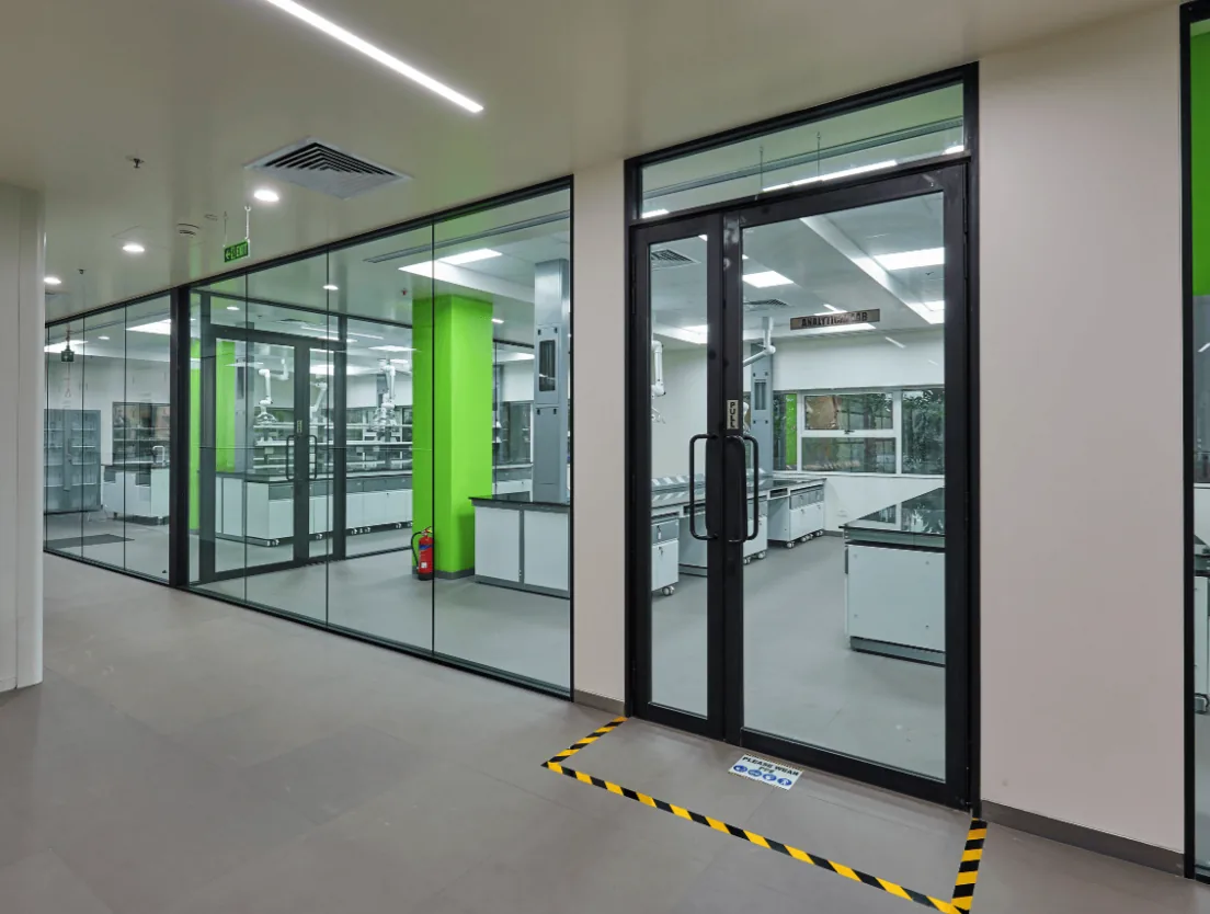 Office floor being converted into a laboratory, with exposed ceiling services