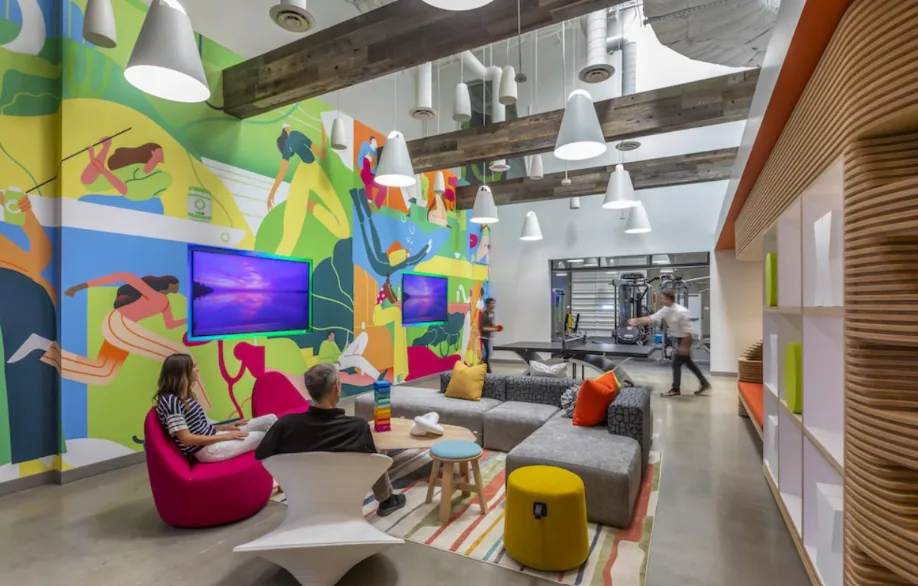 Office breakout area with plants, natural light and lounge seating