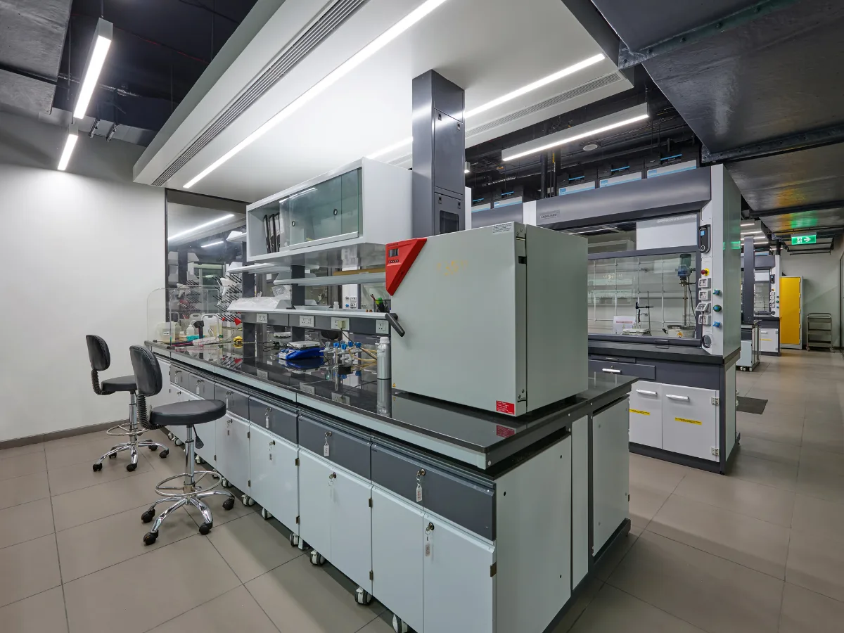 Lab benches with reagent shelves and fume hoods