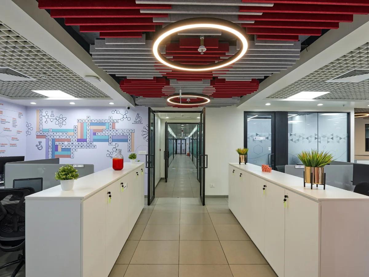 Office corridor with crossword wall mural and acoustic baffles