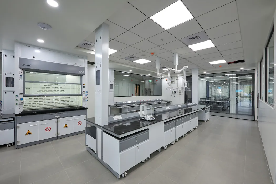 Fume hoods with island bench and overhead snorkel extractors