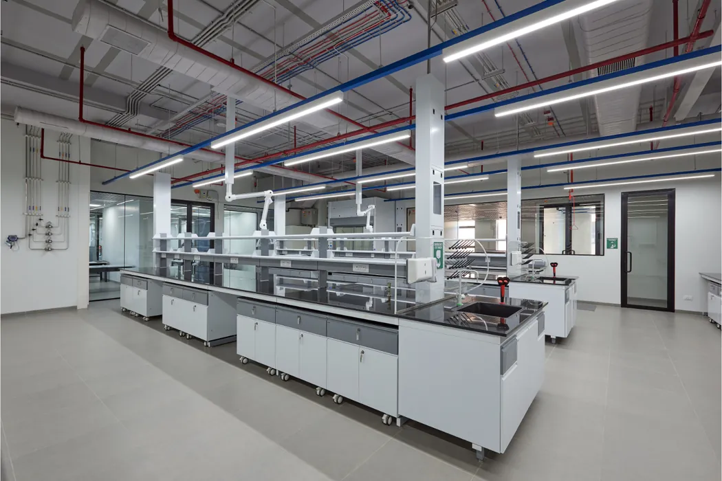 Laboratory with mobile island benches and overhead snorkel extractors