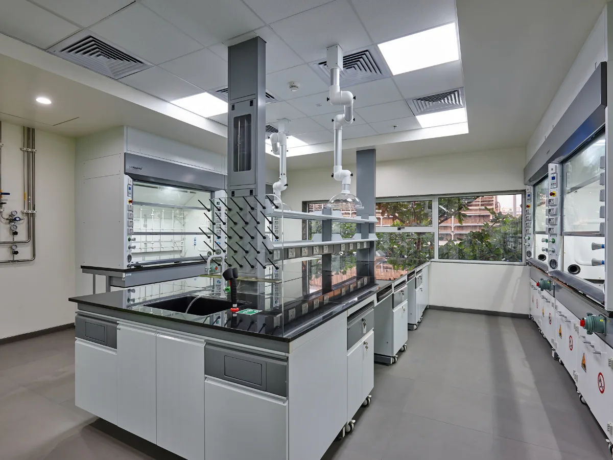Island bench with fume hood, pegboard drying rack and spot extractors