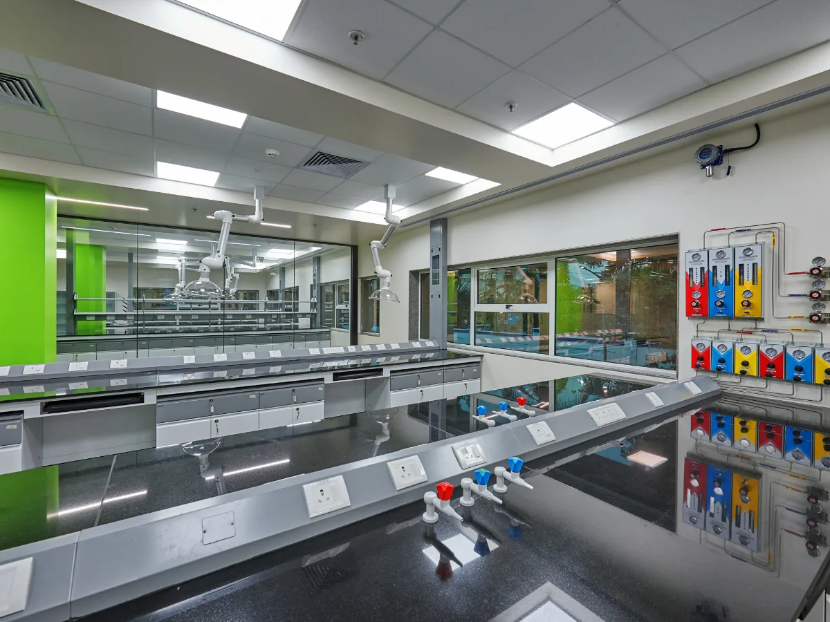 Lab benches with colour-coded gas taps and regulator panels