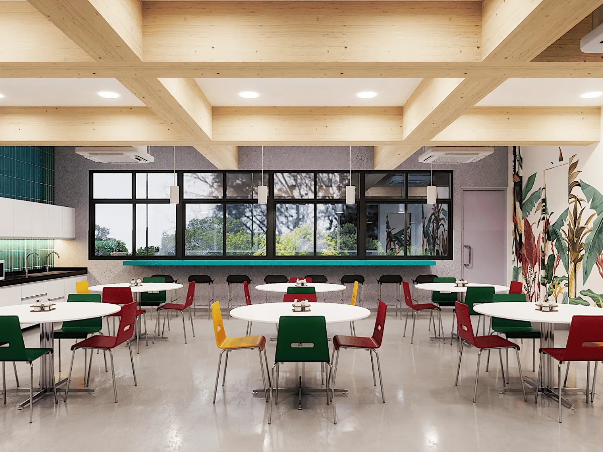 Cafeteria with colourful chairs, round tables and botanical wall mural
