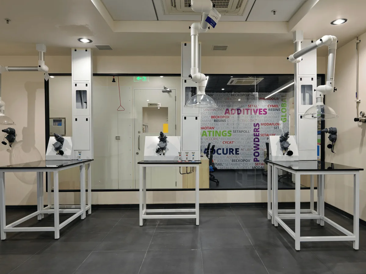 Spot extractor stations with branded product-name glass wall