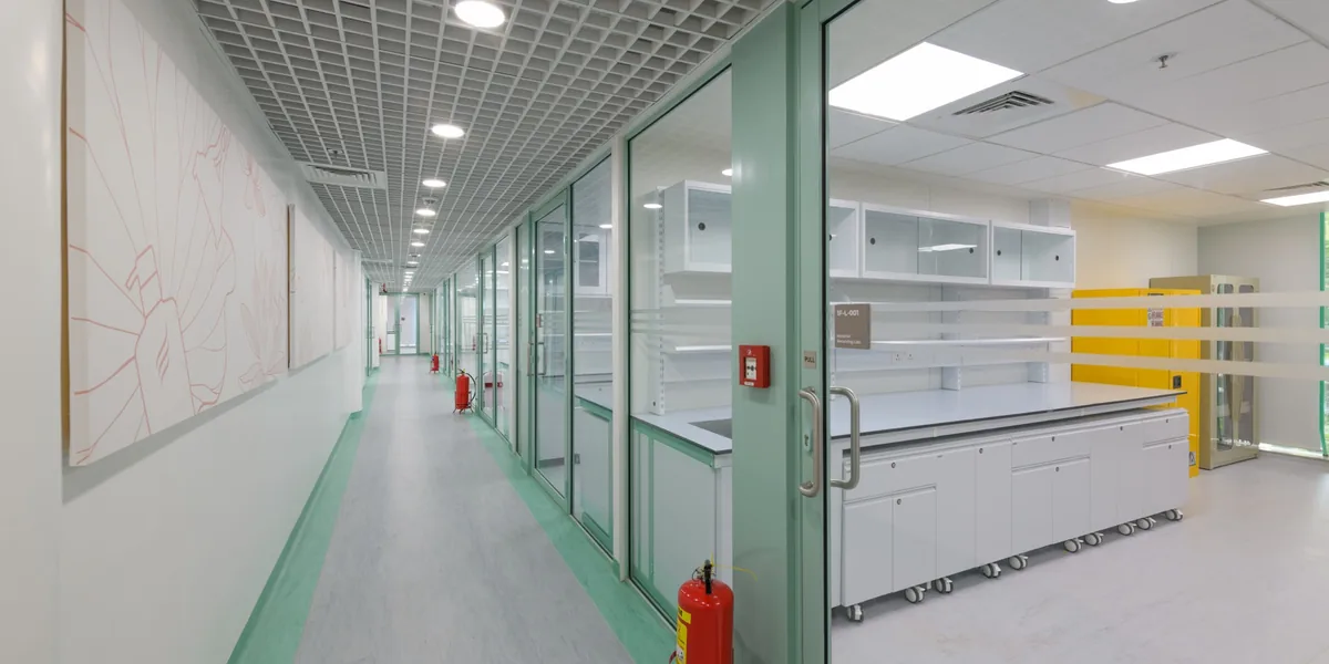 FMCG innovation and product development laboratory in Mumbai with mint-green partitions