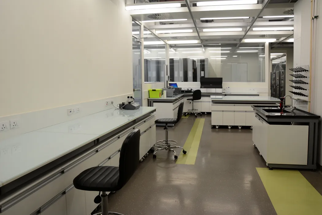 Laboratory benches with instruments and colour-coded floor markings
