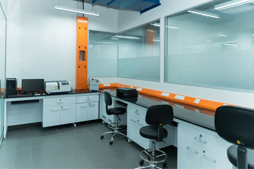 Analytical laboratory with black granite-top benches and analytical instruments