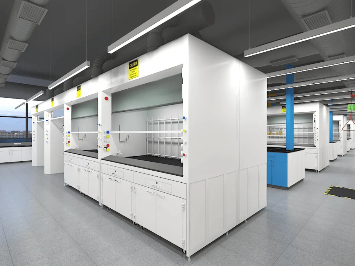 Row of fume hoods with ducting, pegboards, and safety signage