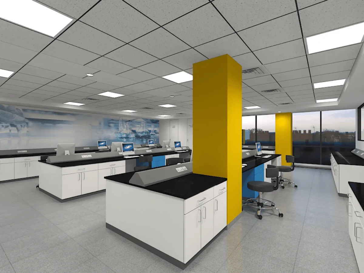 Lab benches with instruments, yellow accent column, and mural wall
