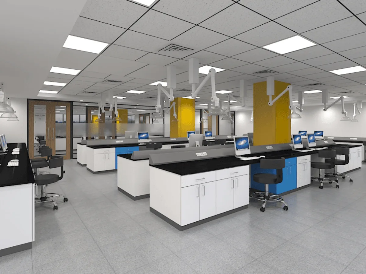 Open lab with island benches, spot extractors, and yellow accent columns