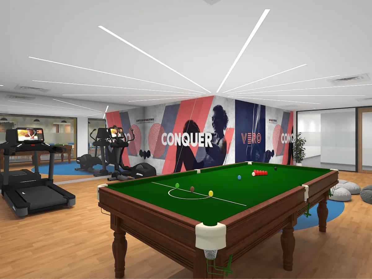 Gaming zone with snooker table, treadmills, and motivational wall graphics