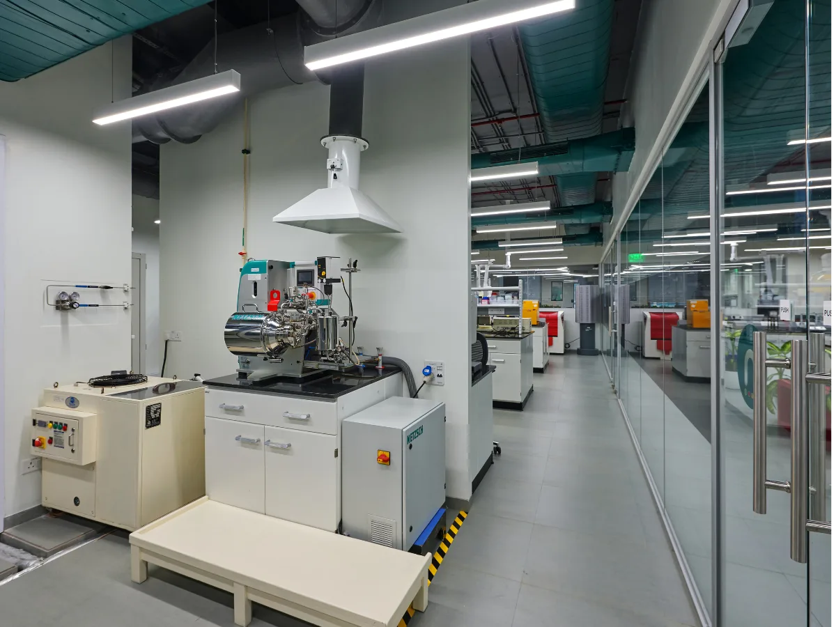 Central lab spine with island benches and canopy hoods