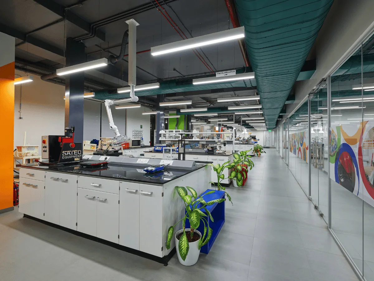 Central lab benches with granite tops and spot extractors