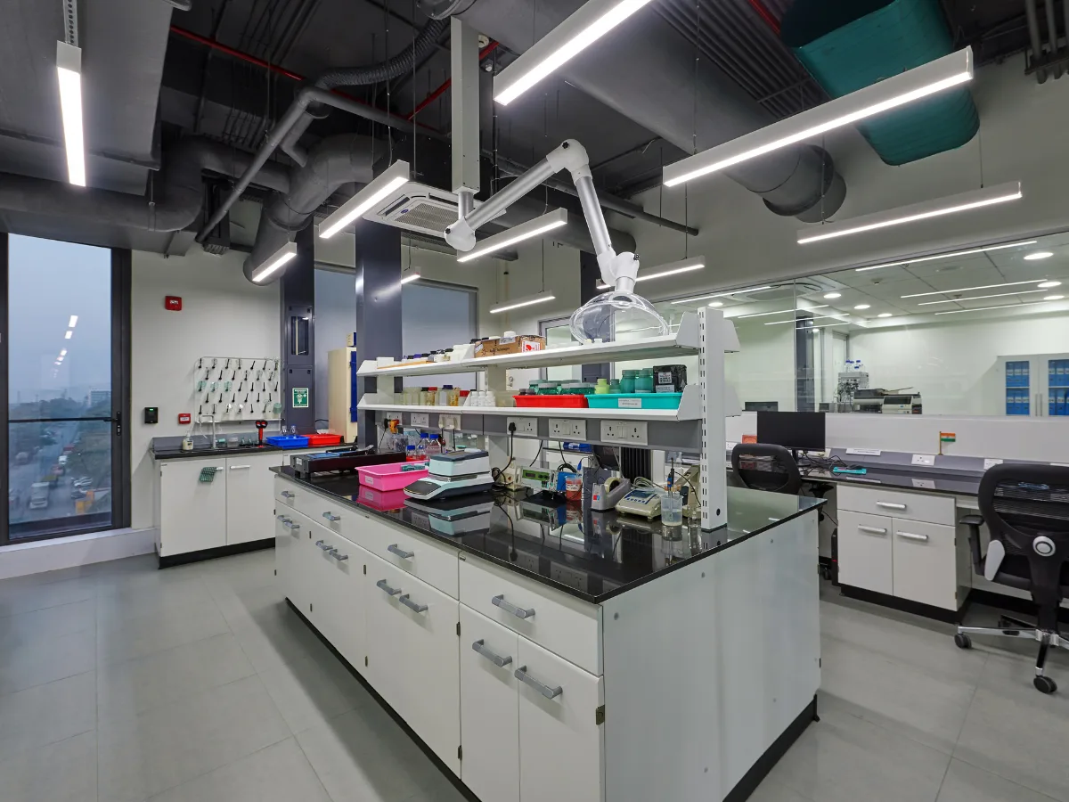 Lab benches with reagent shelves and spot extractors