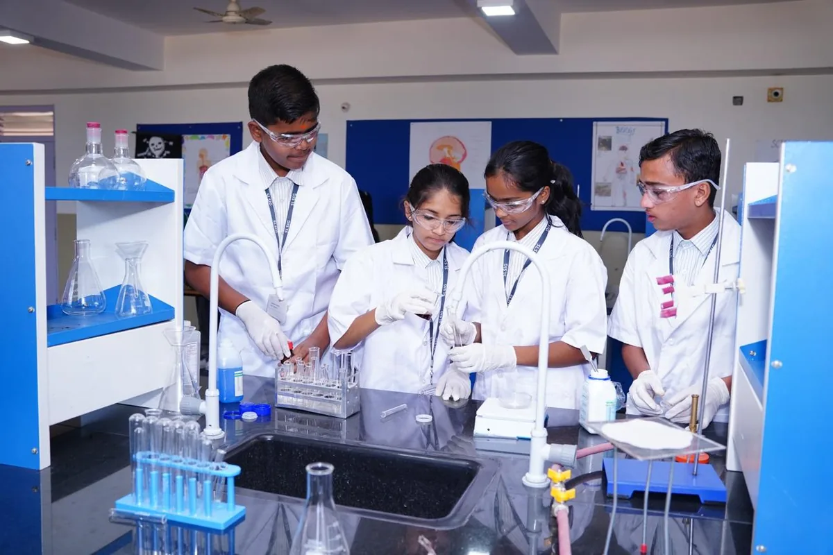 Bright, modern school science laboratory with students at work
