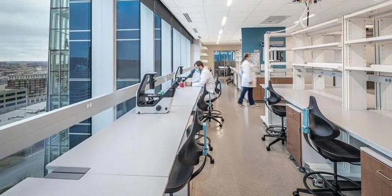Scientist working at a well-designed laboratory bench with good posture