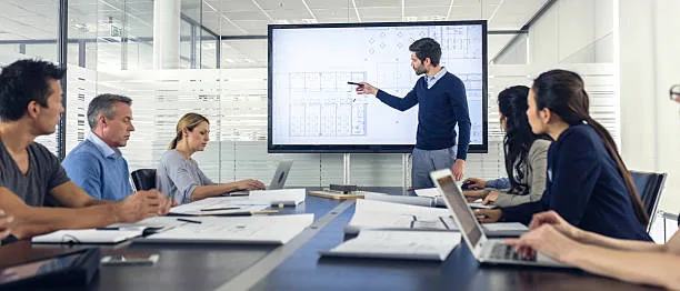 Lab architect discussing a layout with a group of researchers